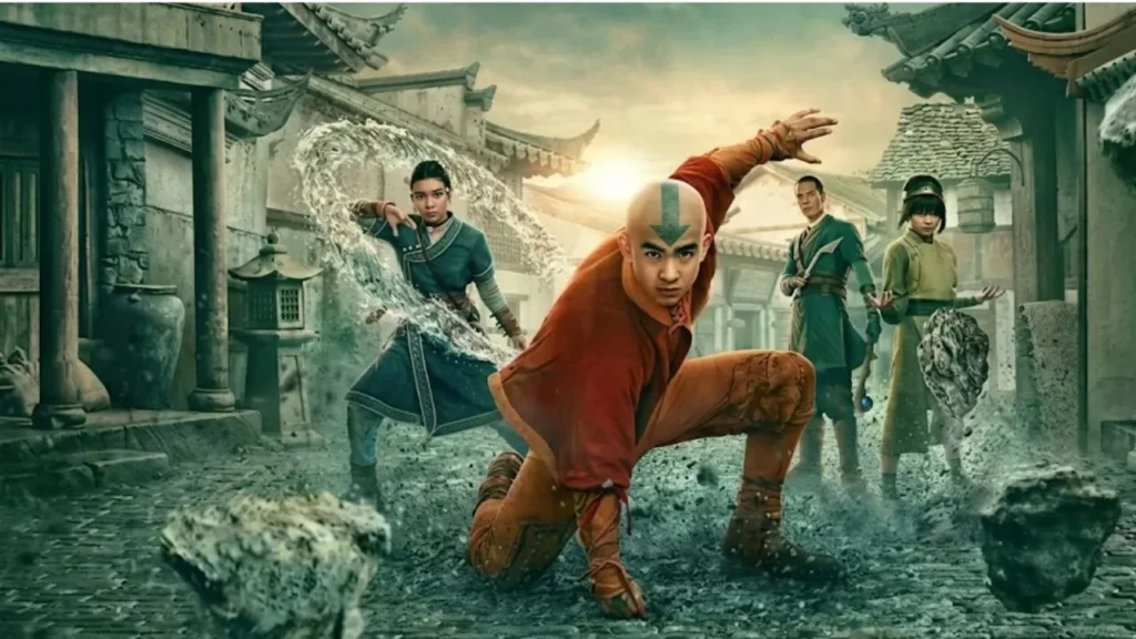 A high-contrast cropped profile photograph of Gordon Cormier as Aang on a dramatic fantasy television set illuminated with deep amber lighting.