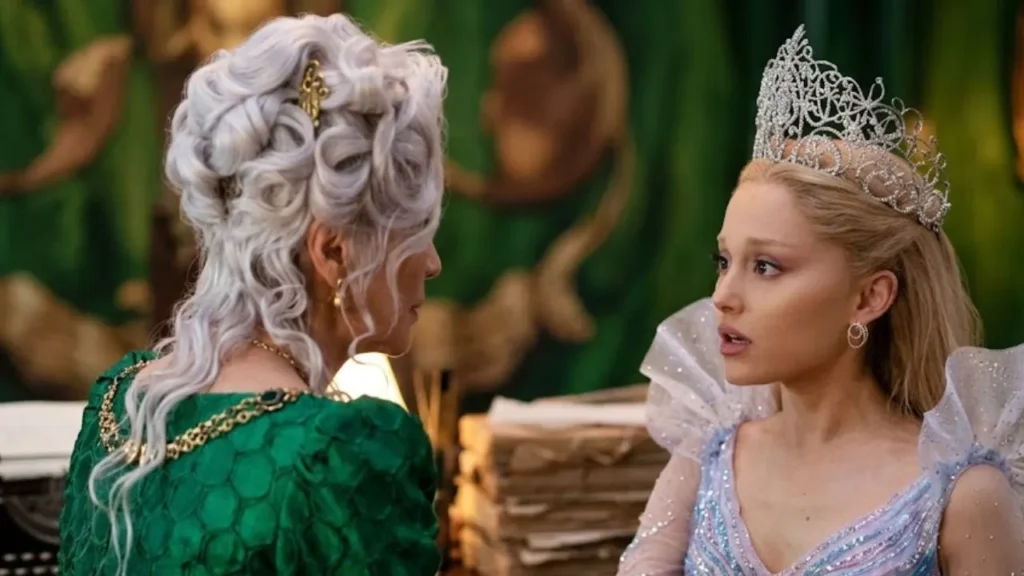 Ariana Grande as Glinda whispering to Cynthia Erivo as Elphaba in the final scene of Wicked: For Good