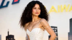Zendaya wearing an ivory Tamara Ralph gown with a gold spider detail in London.