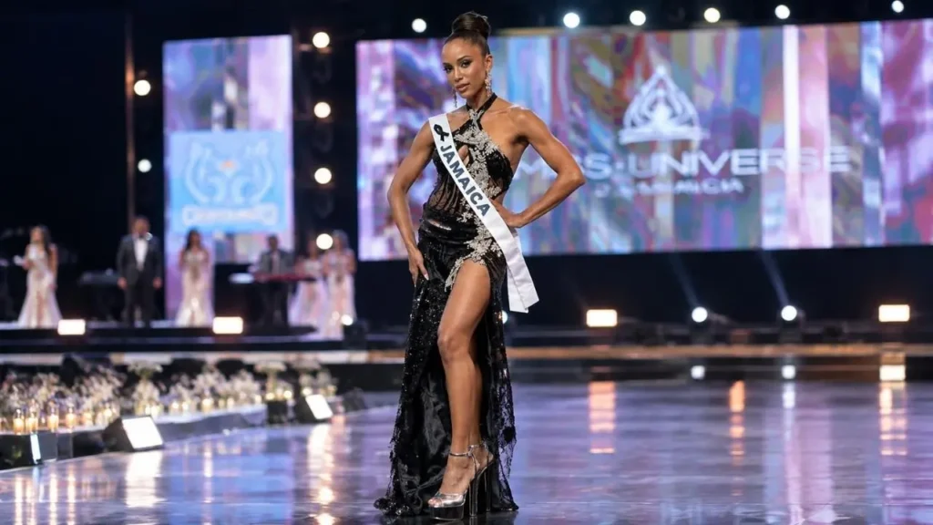 Dr. Gabrielle Henry smiling gracefully in a blue evening gown following her recovery from a pageant fall
