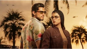 Main protagonists Jason and Lucia riding a motorcycle through neon-lit Vice City in GTA VI