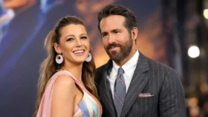 Ryan Reynolds and Blake Lively posing together on a red carpet smiling