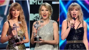 Taylor Swift smiling while holding a Moon Person award trophy at an awards show