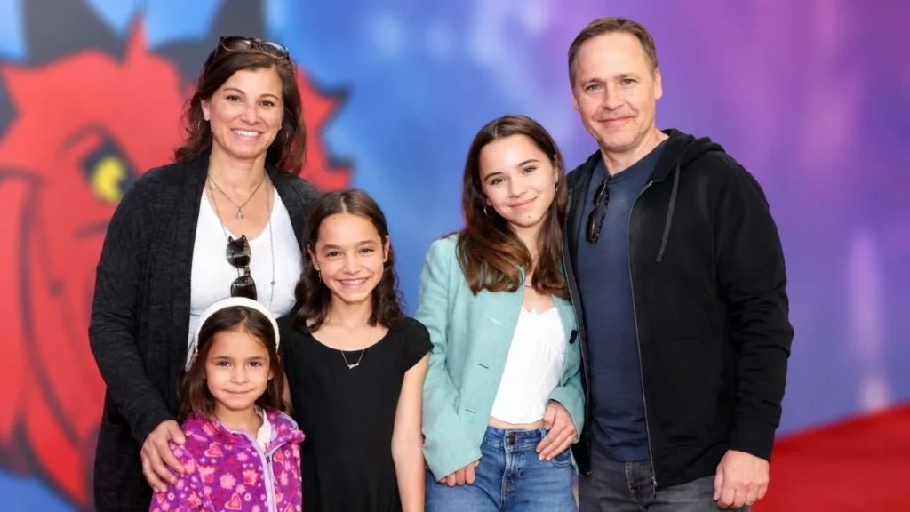 Actor Chad Lowe and wife Kim Painter holding hands at an official public event