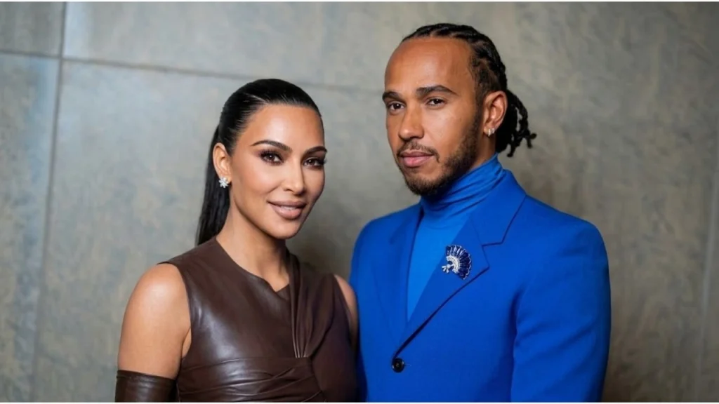 Kim Kardashian posing on red carpet at a media event while discussing her relationship status
