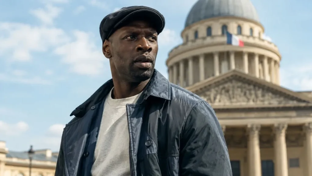 Omar Sy as Assane Diop looking intensely through prison bars in Netflix Lupin Part 4.