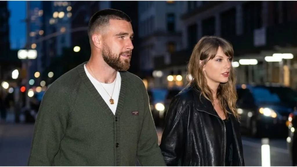 Taylor Swift holding hands with Travis Kelce while arriving for a romantic birthday dinner date in New York City