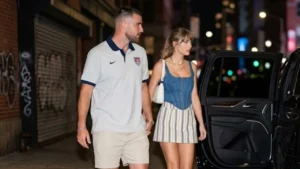 Taylor Swift and Travis Kelce holding hands while leaving a restaurant in SoHo, New York City